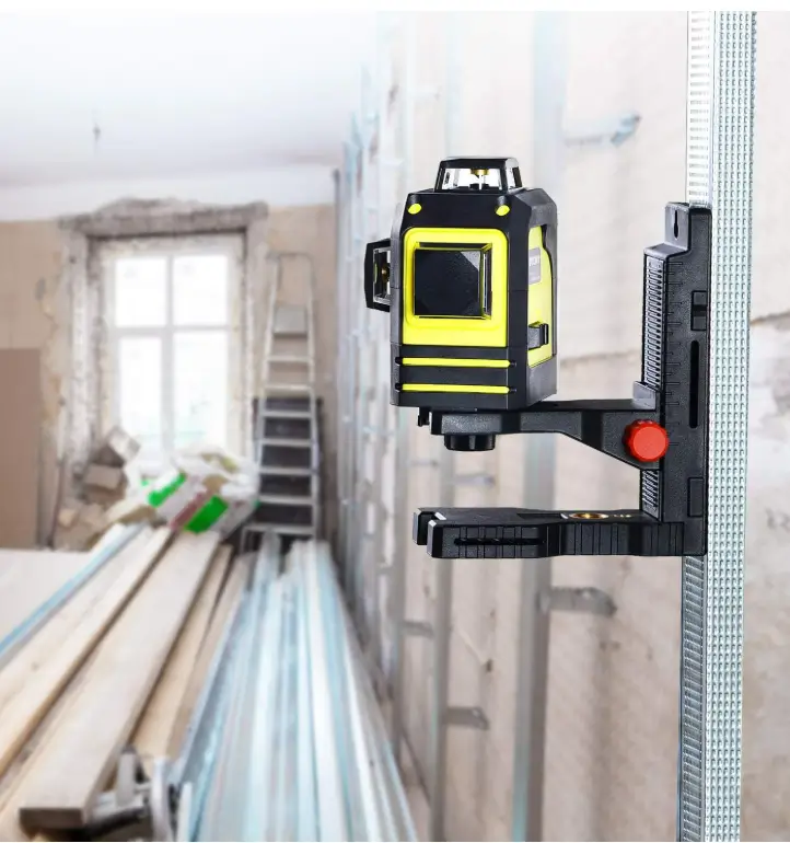 Firecore laser level mounted on a magnetic bracket against steel studwork on a renovation site